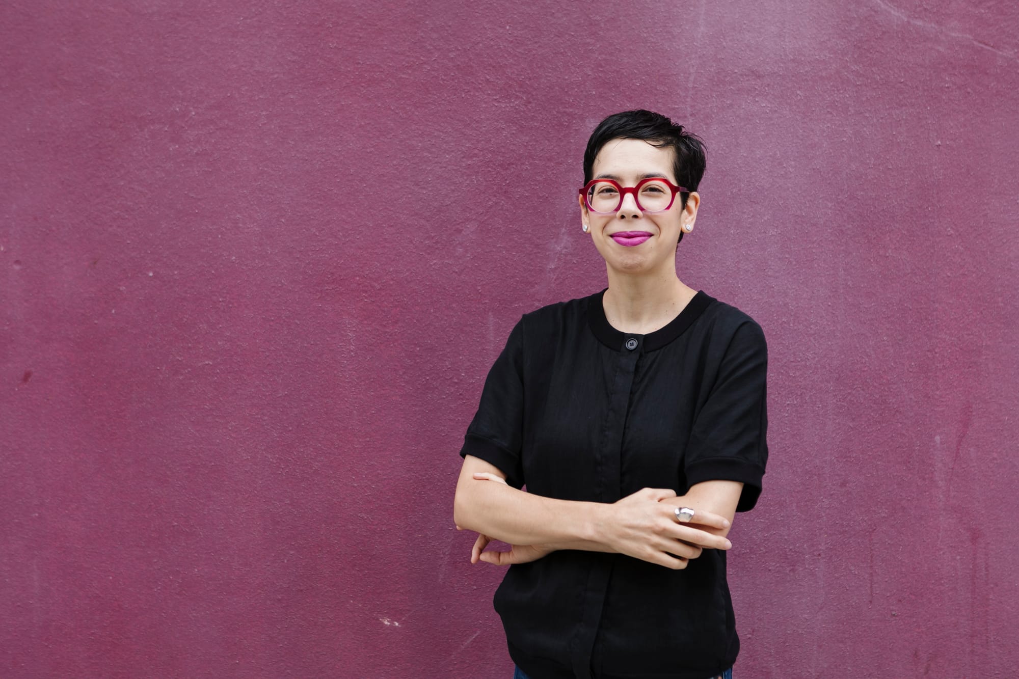 Photo of Ximena Vengoechea against a purple wall